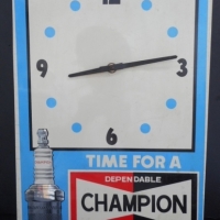 1970's Champion Spark Plugs advertising plastic wall clock - with image of a spark plug & text Time for a Tune-Up, approx 46cm H 31cm L - Sold for $256 - 2016