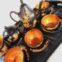 Vintage Japanese black and gilt plastic ware tea service with tray - Sold for $43 - 2016