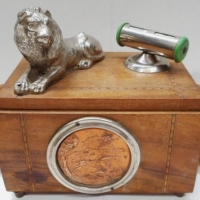 Unusual vintage wooden Desk organizer box with mounted lion, calendar, dual swing out chromes ashtrays, copper landscape, and three tier cantilevered  - Sold for $171 - 2016
