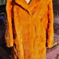 1960s orange lapin fur knee length coat, horizontal leather and fur stripes, fully lined, hook and eye close - Sold for $99 - 2018