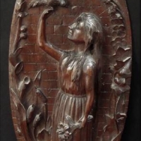 Carved Blackforest plaque of a girl with a bird perched on her hand with foliate surrounds singed TW to base and dated 1891 - Sold for $31 - 2018