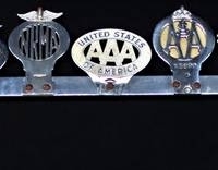 Chrome Grill rack with 9 Car touring club badges incl Belgium, Egypt, USA, Germany, Norway, Auckland etc - Sold for $497 - 2018