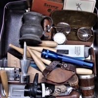 Tin & contents - Blokey items - Cased Pens, old Specs, Lighters, Pipes, Tobacco tins, Watches, etc - Sold for $37 - 2018