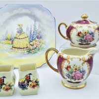 Group-lot-English-China-inc-c1931-Pair-squat-vases-D5099-Sadler-Floral-Gilt-Milk-Jug-matching-Sugar-Bowl-and-Falcon-Ware-Crinoline-lady-plate-Sold-for-37-2020