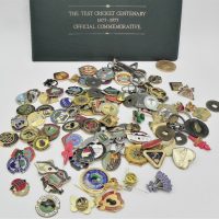 Group-lot-inc-Badges-The-Test-Cricket-centenary-1877-1977-folder-with-coin-included-State-savings-bank-1970-Captain-Cook-medal-etc-Sold-for-50-2020