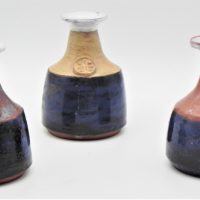Gus-McLaren-1923-2008-set-of-3-Australian-Pottery-Vases-Bulbous-bases-to-slender-necks-flared-tops-all-with-applied-cameos-to-front-Blue-P-Sold-for-360-2020