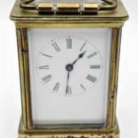 Brass-carriage-clock-with-enamel-Dial-bevelled-glass-with-key-11cms-H-af-Sold-for-93-2021