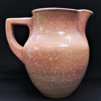 Klytie-Pate-Australian-Pottery-Jug-Pale-Pink-glaze-with-white-snow-like-spots-incised-signature-to-base-20cm-H-Sold-for-236-2021