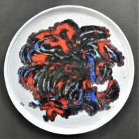 Klytie-Pate-Australian-pottery-plate-with-shallow-lip-grey-with-blueredbrown-abstract-pattern-24cms-D-Sold-for-224-2021