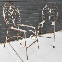 Pair-of-1950s-wrought-Iron-outdoor-chairs-Stylish-shape-scrolly-sides-medallion-shape-back-etc-needing-slats-to-seats-Sold-for-43-2021