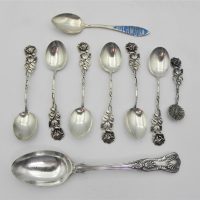 Group-lot-Sterling-Silver-incl-1-x-Sheffield-Hmarked-tea-spoon-set-of-6-x-835-silver-continental-coffee-spoons-plus-one-smaller-rose-pattern-handle-Sold-for-56-2021