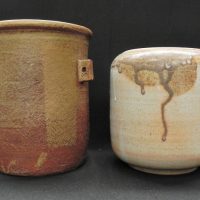 Gus-McLaren-1923-2008-2-x-Australian-Pottery-Jars-both-with-brow-and-cream-glaze-taller-one-with-three-handles-unsigned-tiny-fleabite-to-rim-ot-Sold-for-75-2021