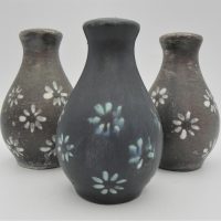 Gus-McLaren-1923-2008-Australian-Pottery-1-x-pair-Salt-Pepper-shakers-and-1-x-Salt-shaker-all-with-matt-brown-and-blue-glaze-with-painted-flowers-Sold-for-112-2021