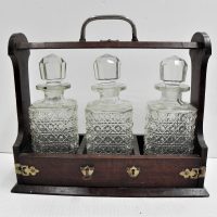 Oak-tantalus-with-key-3-hobnail-decanters-plated-mounts-Sold-for-50-2021