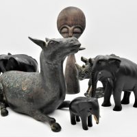 Group-lot-incl-vintage-cast-metal-cow-with-enamelled-floral-back-21cm-W-stone-rhinoceros-figurine-set-of-3-carved-ebony-elephants-some-tusks-missin-Sold-for-161-2021