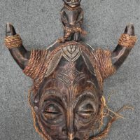 African-tribal-mask-carved-wood-with-sculpted-details-horns-and-raffia-cords-48cm-H-Sold-for-87-2021