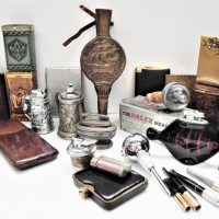 Group-lot-blokey-items-inc-Cigarette-cases-lighters-Leather-cased-flask-Bottle-stoppers-small-bellows-etc-Sold-for-137-2021