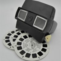 Vintage-Bakelite-View-Master-model-E-with-3-x-Alice-in-Wonderland-slide-reels-Sold-for-37-2021