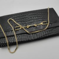 Vintage-Rubino-black-crocodile-leather-clutch-bag-with-gilt-trim-and-detachable-chain-strap-Sold-for-43-2021