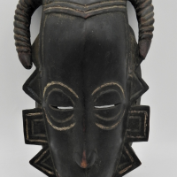 African-Tribal-Mask-carved-and-incised-with-horns-and-natural-ochre-painted-design-possibly-Baoul-Ivory-Coast-damage-sighted-at-the-back-approx-Sold-for-43-2021