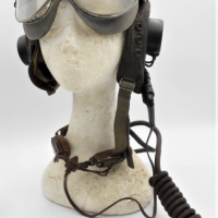Group-lot-Vintage-WW2-Pilots-gear-Leather-Pilots-Helmet-with-comms-equipment-incl-Earpieces-original-Throat-Microphone-Laryngophone-Goggles-Sold-for-248-2021