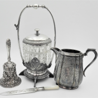 Group-of-vintage-silver-plate-items-incl-Heavily-embossed-bell-hobnail-cut-crystal-pickles-jar-in-stand-W-H-Jug-serrated-knife-with-mop-handle-Sold-for-118-2021