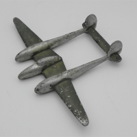 Vintage-aluminium-WW2-Trench-Art-P-38-Lightning-Fighter-plane-hole-in-base-to-mount-some-green-paintwork-approx-172-scale-Sold-for-56-2021