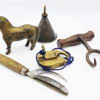 Group-lot-vintage-Blokey-items-inc-cast-iron-hay-bail-hook-with-wooden-handle-cast-metal-horse-figurine-named-Beauty-small-oil-can-and-an-Eden-lo-Sold-for-62-2021