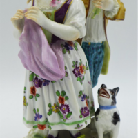 20th-C-Meissen-figurine-boy-with-flowers-girl-dog-14cms-H-marks-to-base-Sold-for-248-2021