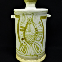 Gus-McLaren-Australian-Pottery-signed-Cream-glaze-lidded-jar-with-green-glaze-fish-decoration-to-front-back-21cm-Sold-for-124-2021