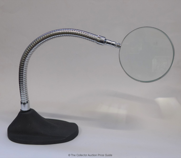 Sold at Auction: Large Magnifying Glass On Swivel Stand