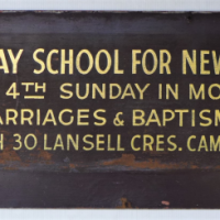 Vintage-advertising-sign-Services-Sunday-School-for-new-Australians-etc-gold-lettering-on-brown-masonite-panel-92-x-26cms-Sold-for-50-2021