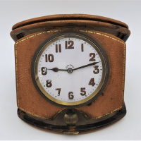 c1905-Swiss-Travel-Clock-8-Days-movement-patented-in-1905-by-Georges-Ducommun-later-Doxa-founder-working-and-keeping-time-in-original-leather-cas-Sold-for-124-2021