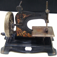 c1920 TIN TOY SEWING MACHINE - Sold for $67 - 2009