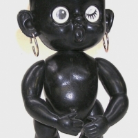 1950's plastic BLACK WINKY DOLL with wide open mouth & hoop earrings - approx 25cm L - Sold for $30 - 2012
