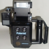 POLAROID Miniportrait Camera with built in flash and detachable film cassette - Sold for $73 - 2012