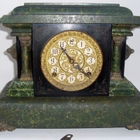 EN WELCH Mantle Clock 8 Day with half hour & hour gong, mottled green case with ornate brass face and decoration - Sold for $98 - 2012