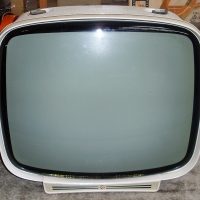 Stylish Black & White PYE Television, cream case with light coloured leatherette covering and 2 gilt carry handles - Sold for $98 - 2012