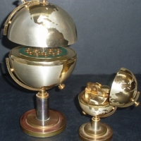 2 x Piece 1950/60's SMOKING SET - World globes on stands, one opens to be Cigarette lighter, the other opens to be Cigarette Dispenser - Sold for $73 - 2012