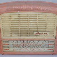 ASTOR Radio in salmon pink plastic case with cream grill, - Sold for $183 - 2012