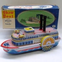 Boxed TIN TOY  - Show Boat with whistle & smoke - made by Modern Toys, Japan - battery operated 35cm long - Sold for $256 - 2012