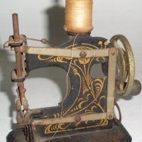 1920's German Made Miniature Metal  Sewing Machine - Sold for $37 - 2012