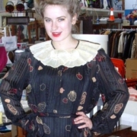 1980's ZANDRA RHODES black silk pleated dress with shell pattern, wide pleated shell theme collar with faux pearl highlights, black underskirt - Sold for $37 - 2012