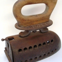 coal iron with wooden handle and decorative top-plate - Sold for $49 - 2013