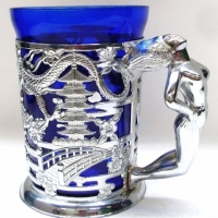 1970's large Tankard with blue glass insert & silvered nude lady handle, dragons to body - Sold for $24 - 2013