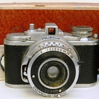 c1940's PHOTAVIT miniature 35mm film camera with Schneider lens and Compur shutter, stamped 4293 to base with original cardboard bo - Sold for $43 - 2013