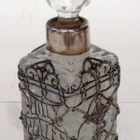 CRYSTAL Holy Water container with Ssilver collar & stopper, silver filigree  decoration  to body with text 'Holy Water & Crucifixes' -  - Sold for $281 - 2013
