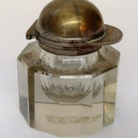 Heavy glass ten sided ink well with brass jockey cap  shaped lid - Sold for $110 - 2013