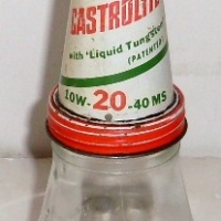 Embossed Wakefield Castrol Motor Oil Bottle with tin Castrolite funnel (one imperial pint) - Sold for $92 - 2013