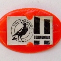 orange plastic football shaped COLLINGWOOD cereal toy pin - Sold for $30 - 2013